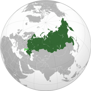 A globe projection highlighting the Russian Federation in dark green, including its internationally disputed annexed territories. The map emphasizes Russia's vast geographic expanse across Eastern Europe and Northern Asia, with surrounding countries shown in gray for contrast. Suitable for geopolitical or Ukraine attack analysis in 2025.